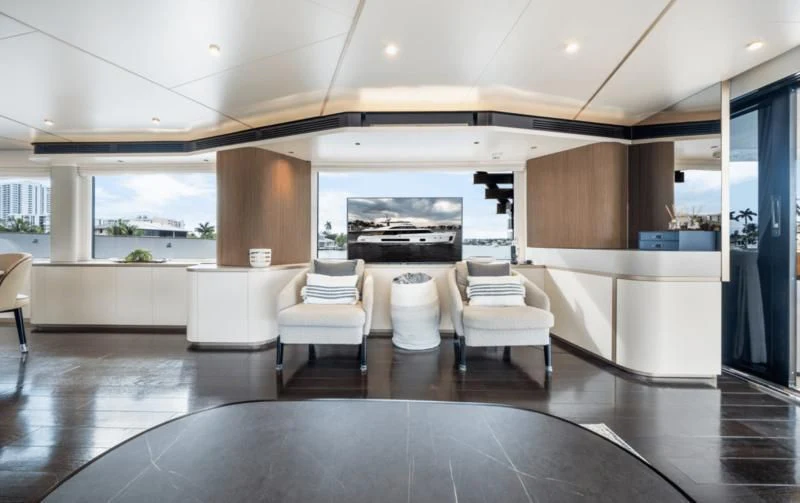 a room with a large table and chairs aboard GAS Yacht for Sale