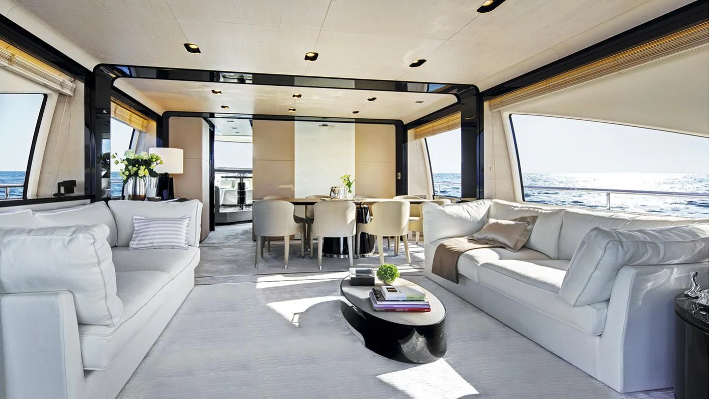 a living room with a couch and a table aboard GAS Yacht for Sale