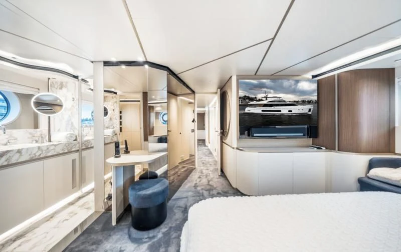 a room with a bed and a desk aboard GAS Yacht for Sale