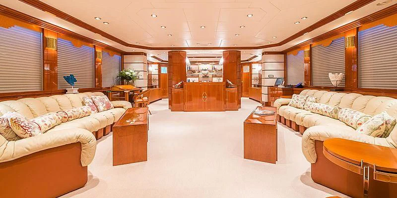 a living room with a couch and a table aboard B5 Yacht for Sale