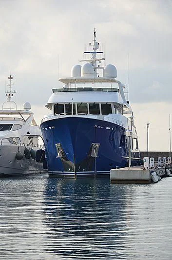a large blue boat in the water aboard B5 Yacht for Sale