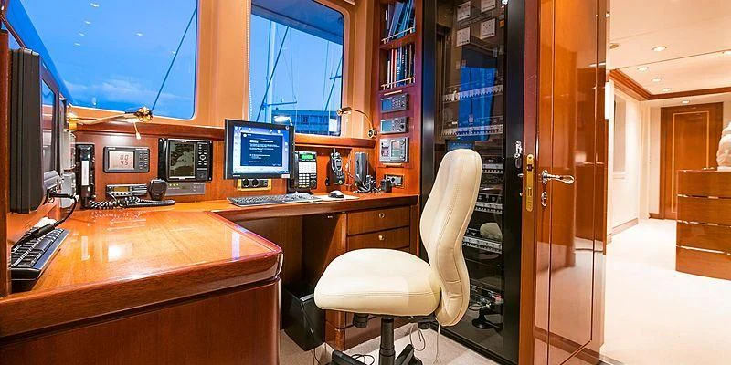 a room with a desk and computer aboard B5 Yacht for Sale
