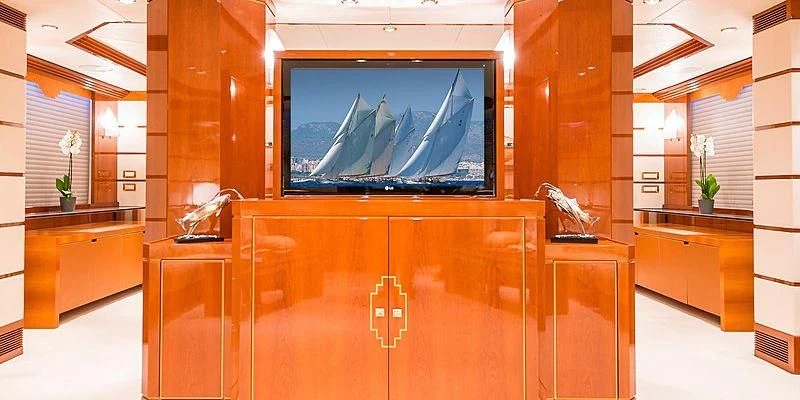 a room with a tv and cabinets aboard B5 Yacht for Sale