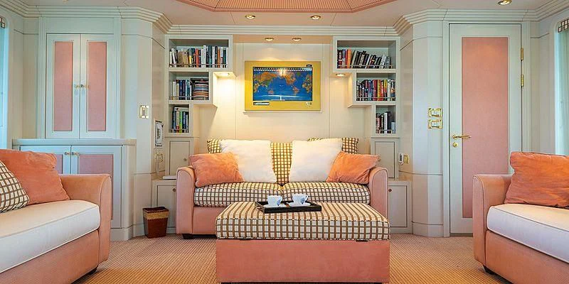 a living room with a couch and a table aboard B5 Yacht for Sale