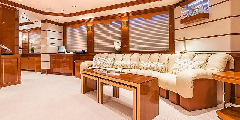 a living room with a couch and a table aboard B5 Yacht for Sale