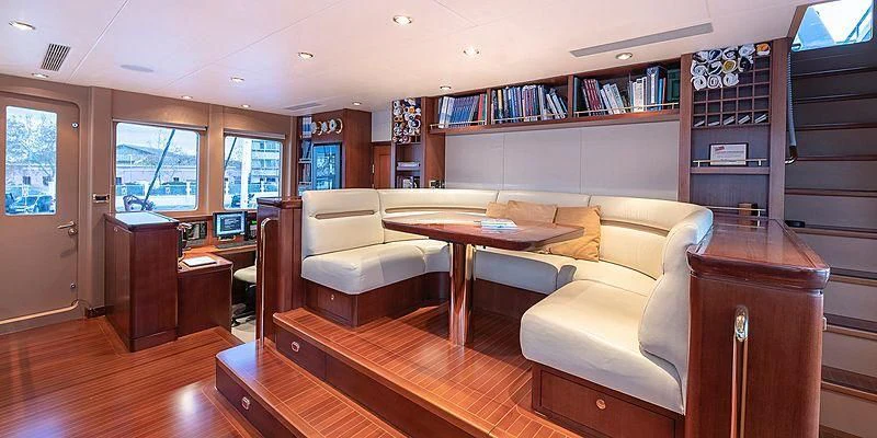 a living room with a couch and a coffee table aboard B5 Yacht for Sale