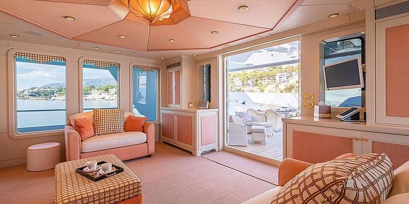 a living room with a large window aboard B5 Yacht for Sale