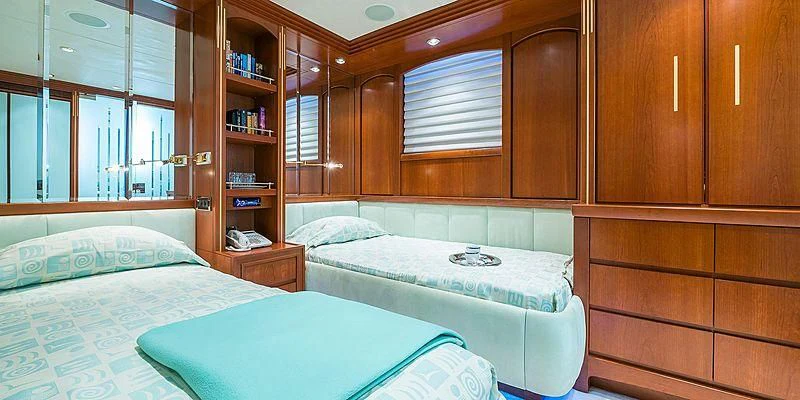 a room with a few beds aboard B5 Yacht for Sale