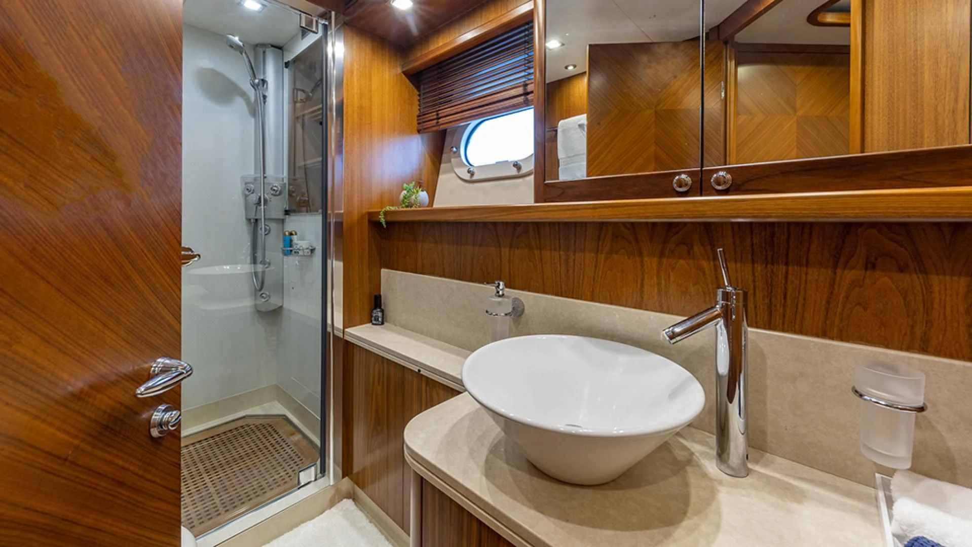 a bathroom with a sink and a shower aboard KEFI Yacht for Charter