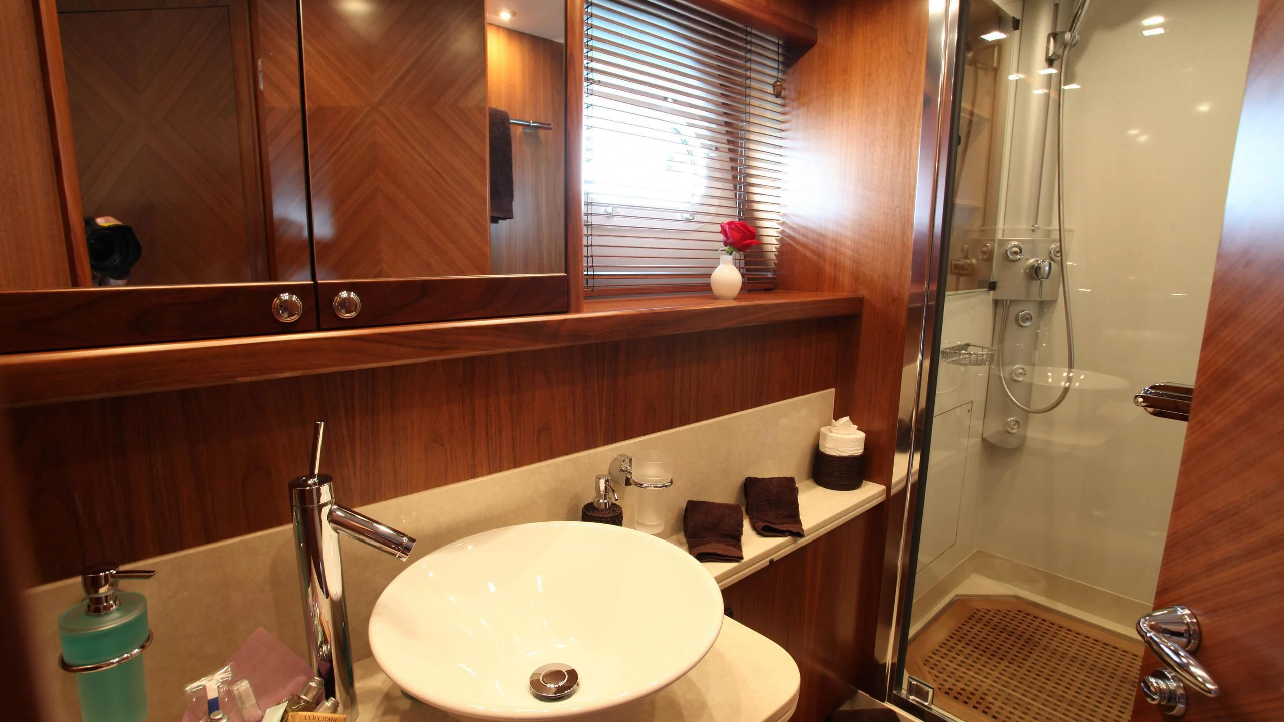 a bathroom with a sink and a shower aboard KEFI Yacht for Charter