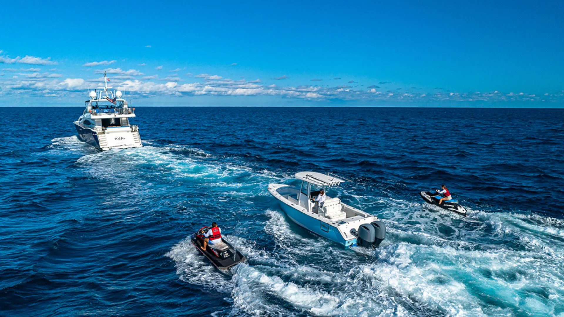a group of boats in the ocean aboard KEFI Yacht for Charter