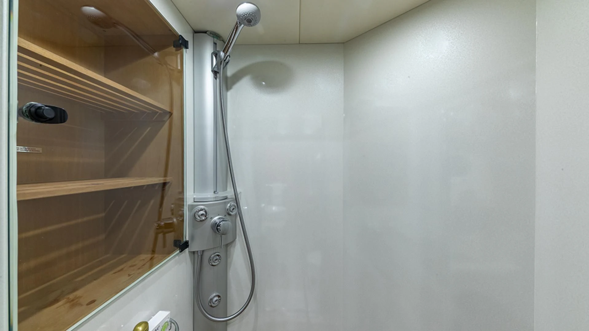 a shower with a glass door aboard KEFI Yacht for Charter