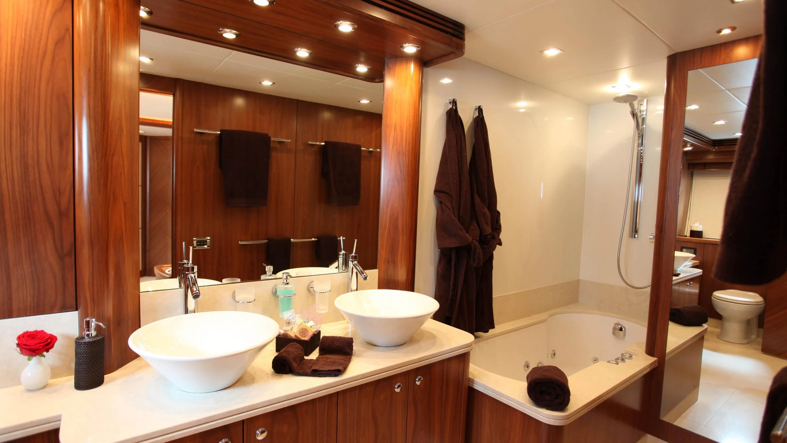 a bathroom with a large mirror aboard KEFI Yacht for Charter
