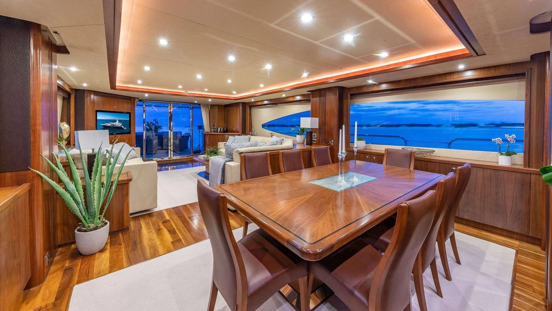 a dining table in a room aboard KEFI Yacht for Charter