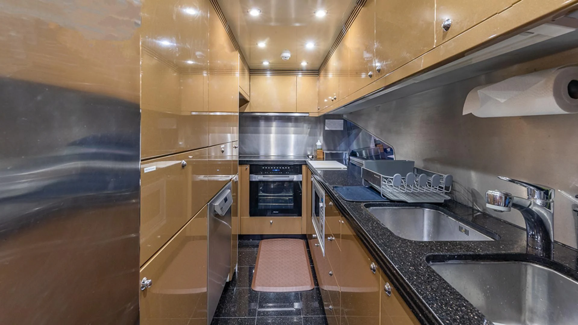a kitchen with a stove and sink aboard KEFI Yacht for Charter