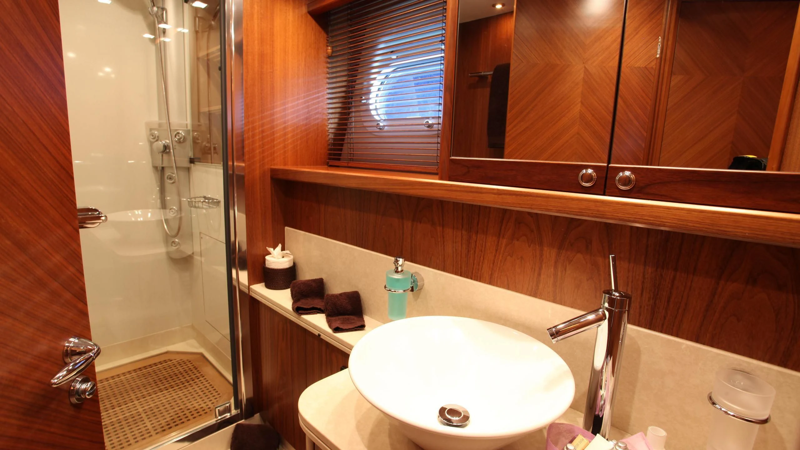 a bathroom with a sink and a shower aboard KEFI Yacht for Charter