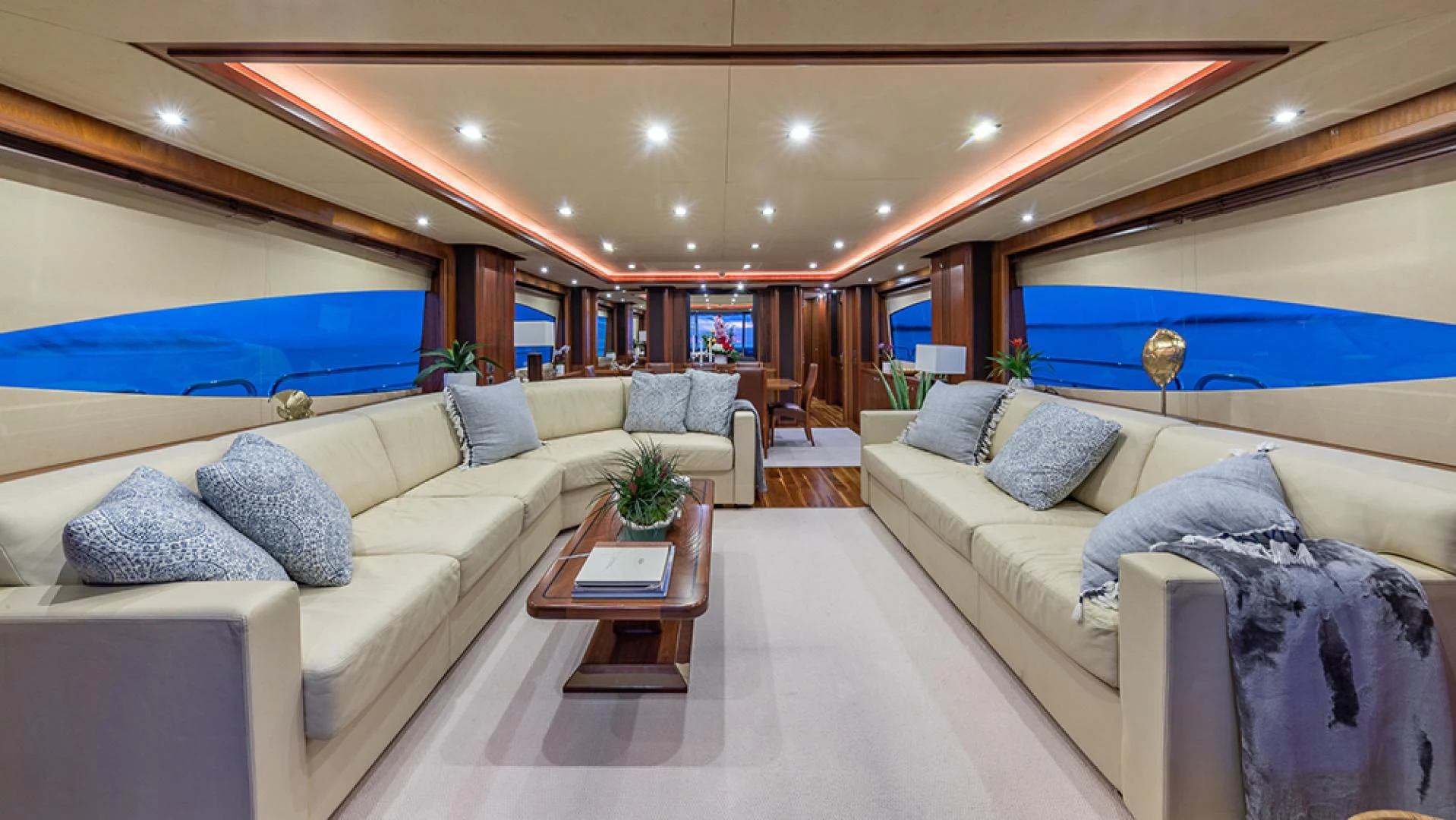 a living room with a couch and a table aboard KEFI Yacht for Charter