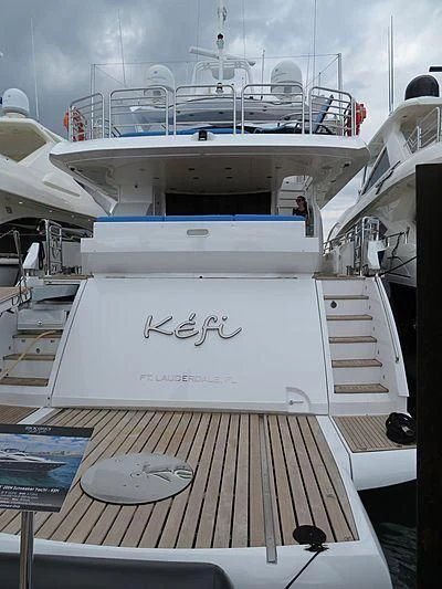 a boat with a table and chairs aboard KEFI Yacht for Charter