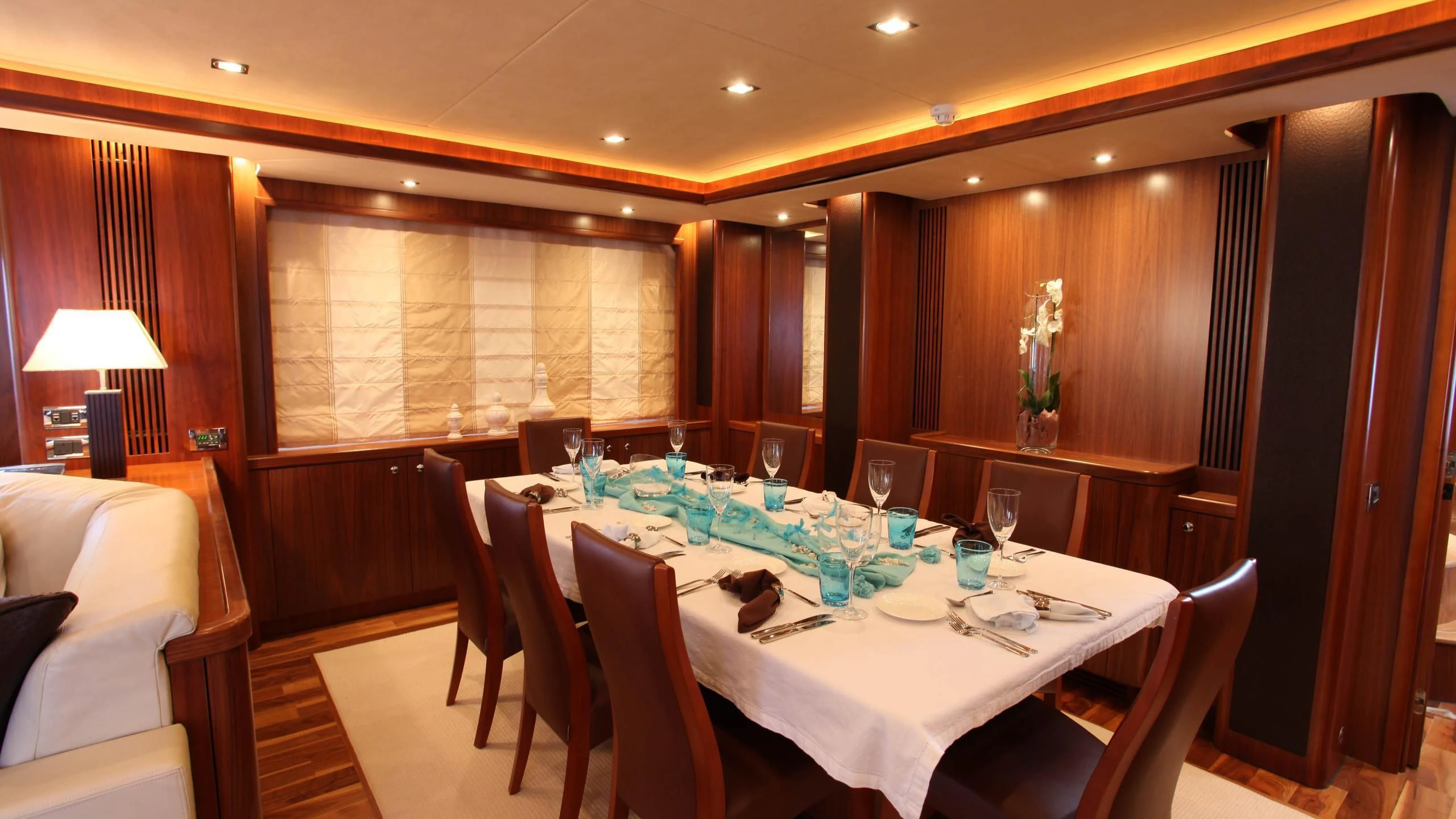 a room with a table and chairs aboard KEFI Yacht for Charter