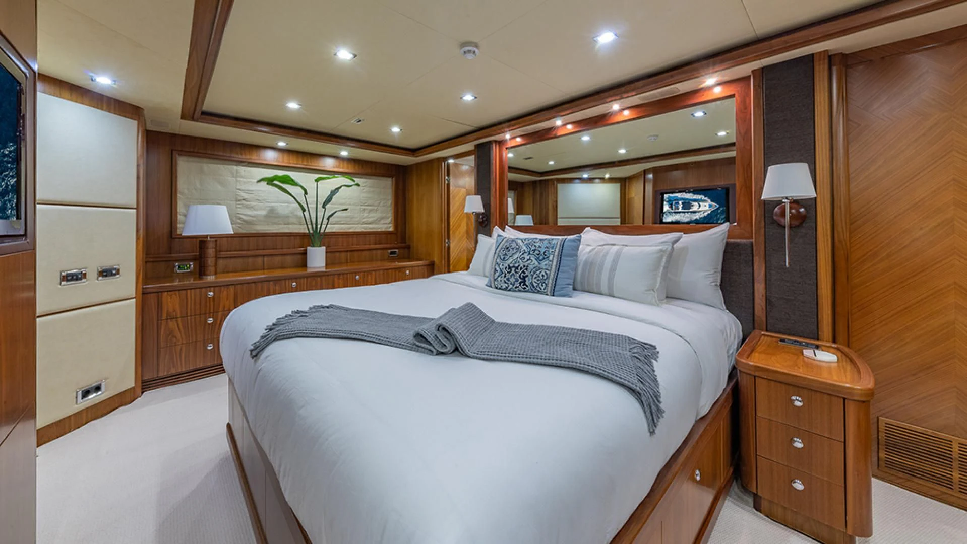 a bedroom with a large bed aboard KEFI Yacht for Charter