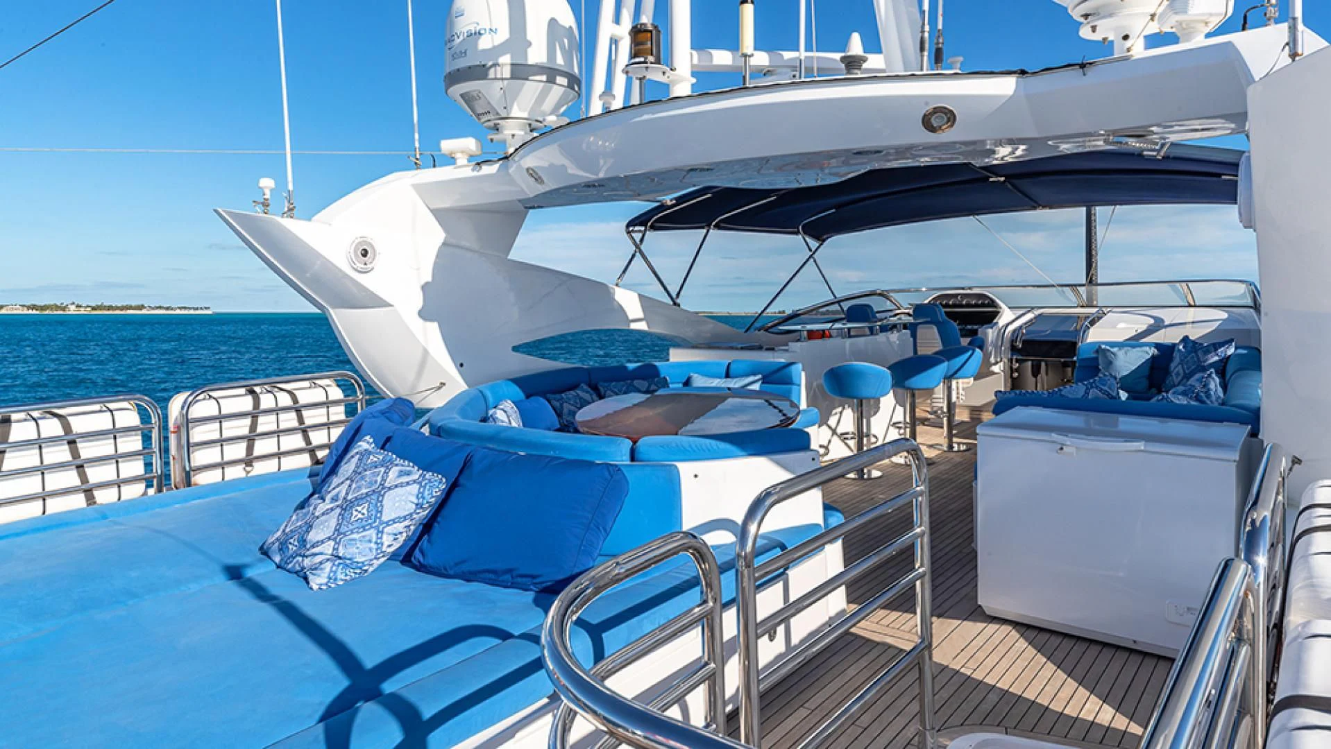 a boat with blue seats aboard KEFI Yacht for Charter