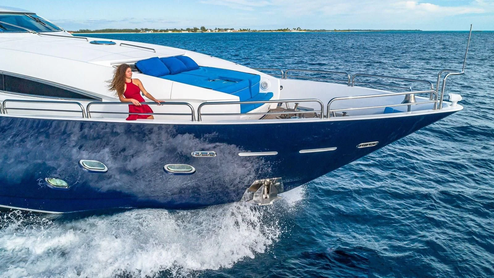 a person in a red bikini on a boat in the water aboard KEFI Yacht for Charter