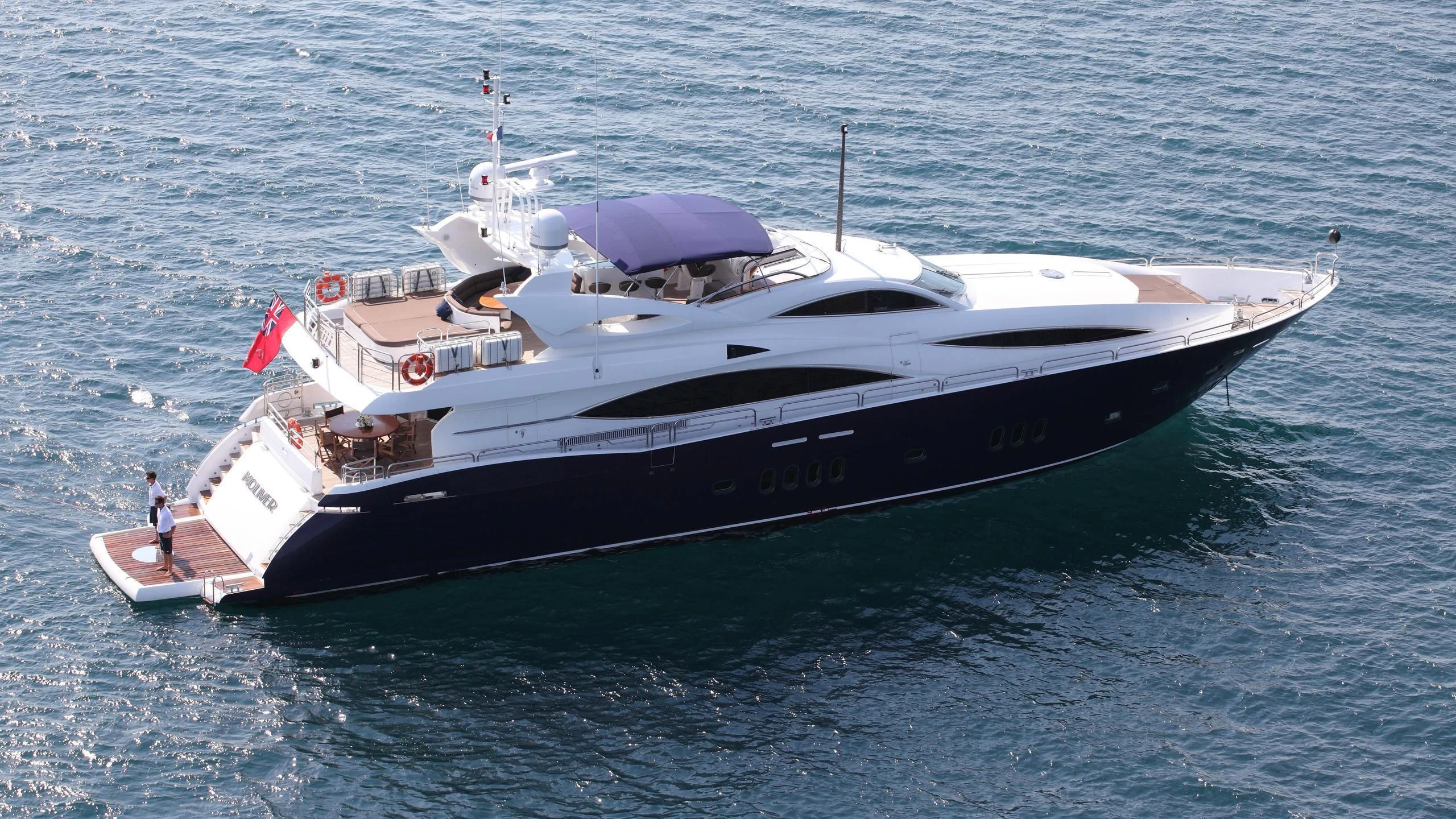 a large white boat in the water aboard KEFI Yacht for Charter