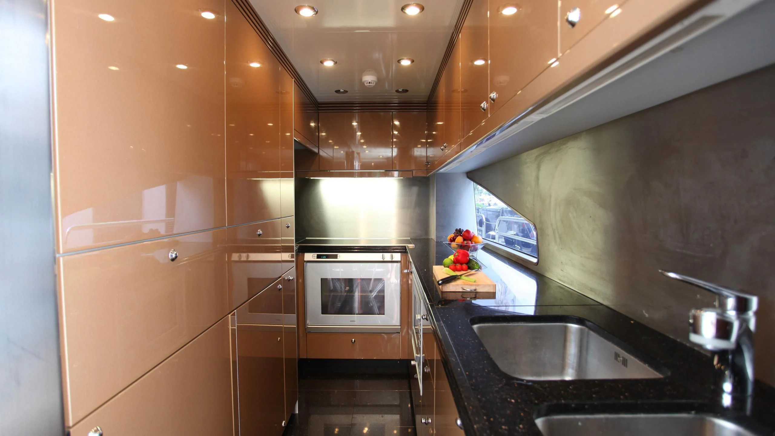 a kitchen with a sink and a microwave aboard KEFI Yacht for Charter