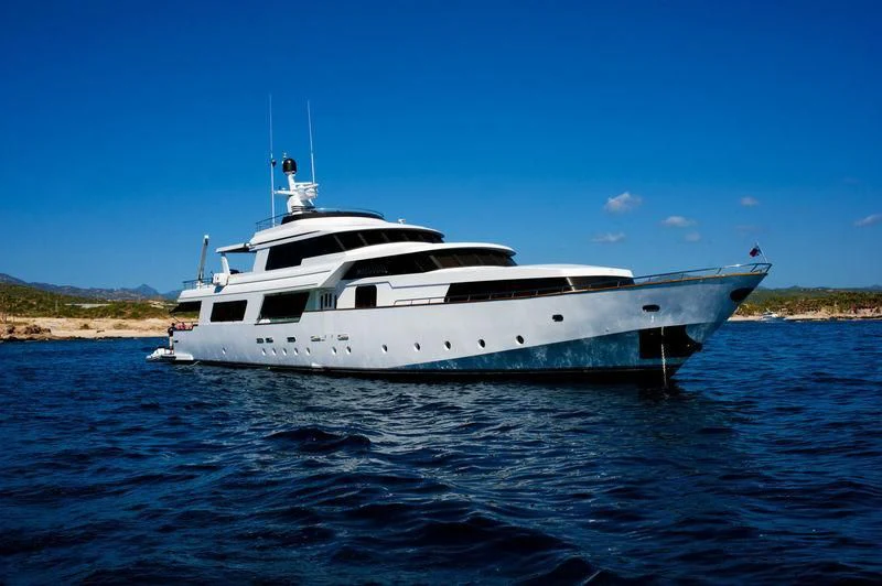 a white yacht on the water aboard MARANATHA Yacht for Sale