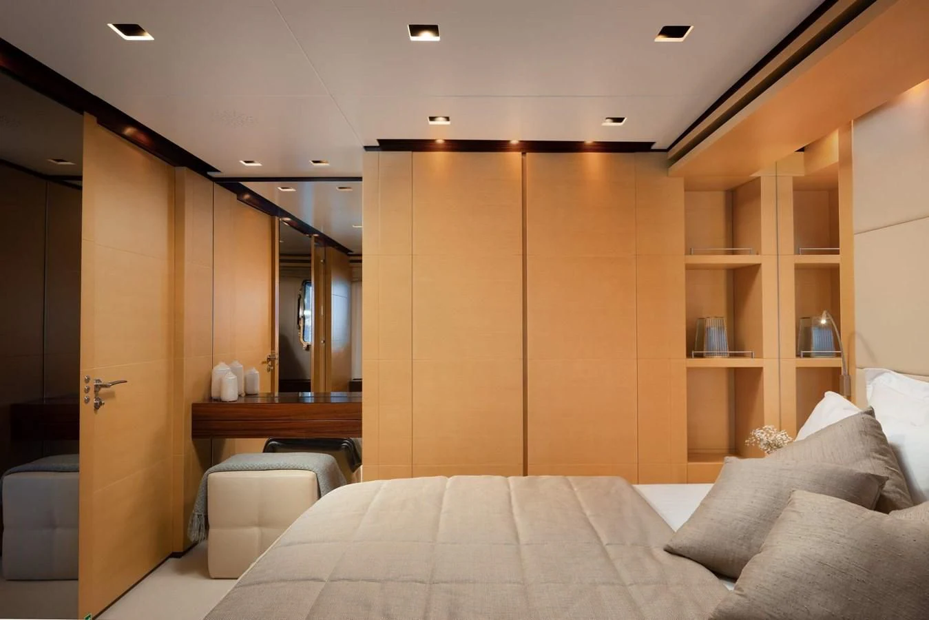 a room with a bed and cabinets aboard LAMMOUCHE Yacht for Sale