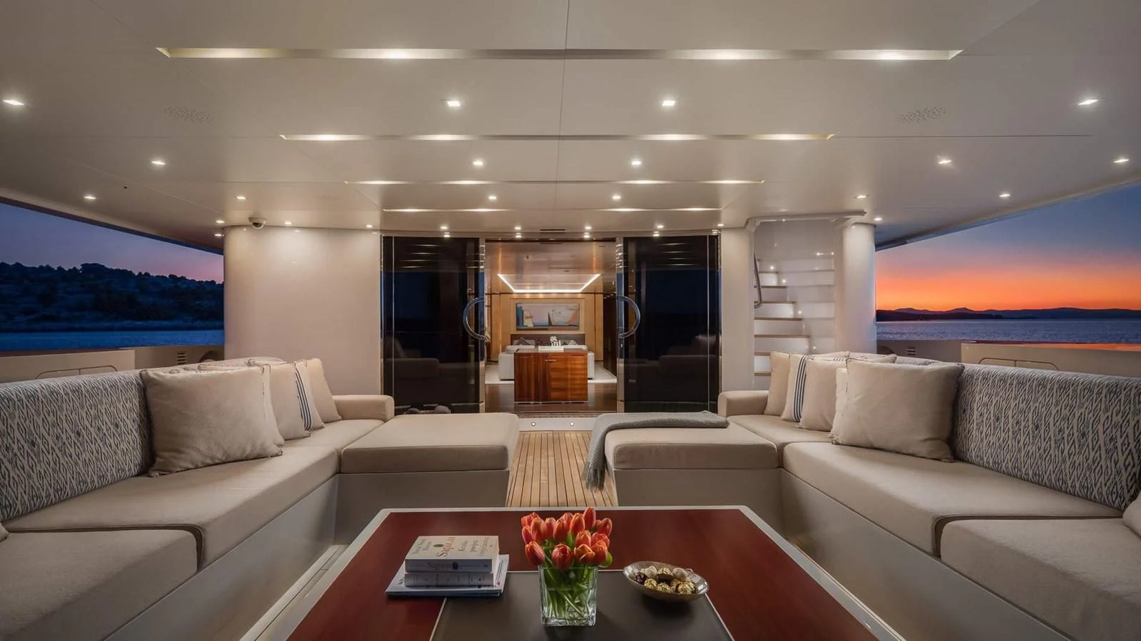 a living room with a large screen aboard LAMMOUCHE Yacht for Sale