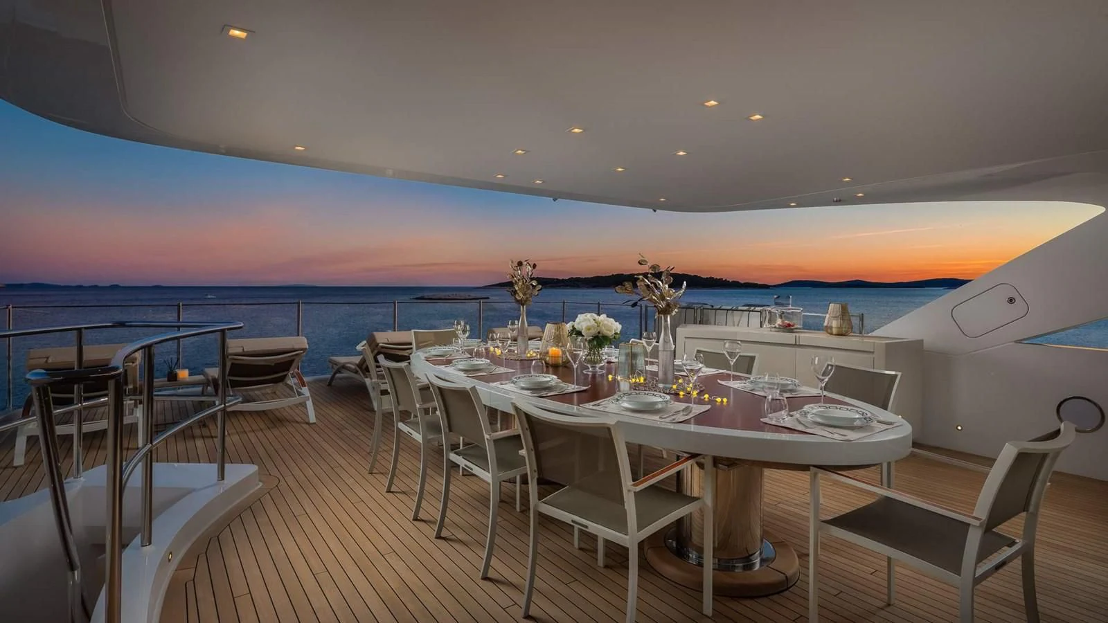 a room with a table and chairs aboard LAMMOUCHE Yacht for Sale