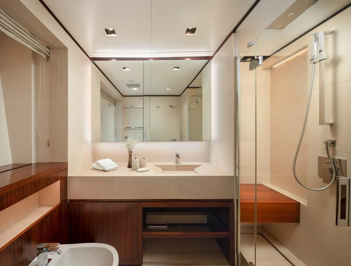 a bathroom with a shower unit and sink aboard LAMMOUCHE Yacht for Sale