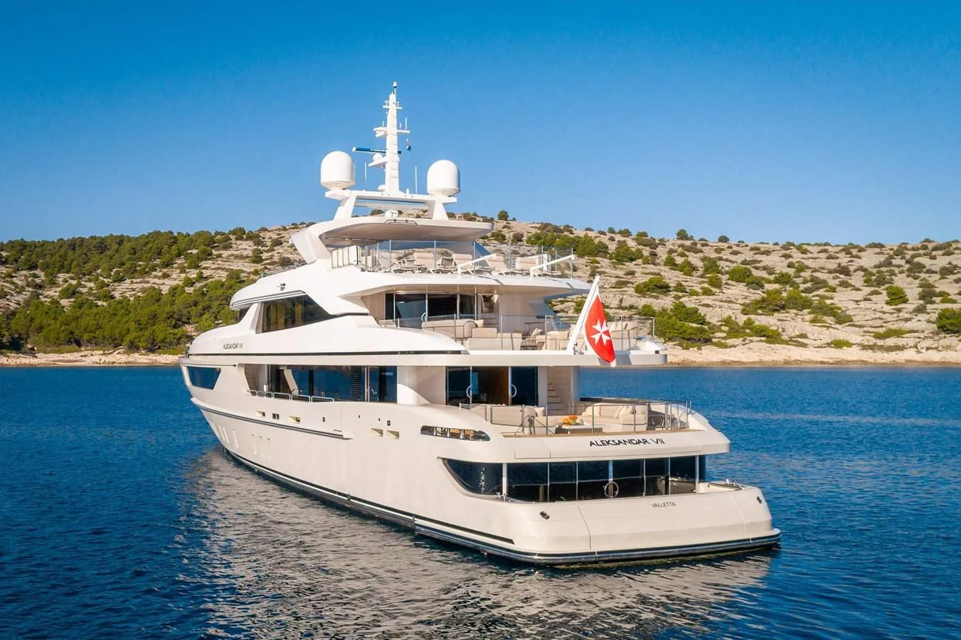 a large white boat in the water aboard LAMMOUCHE Yacht for Sale