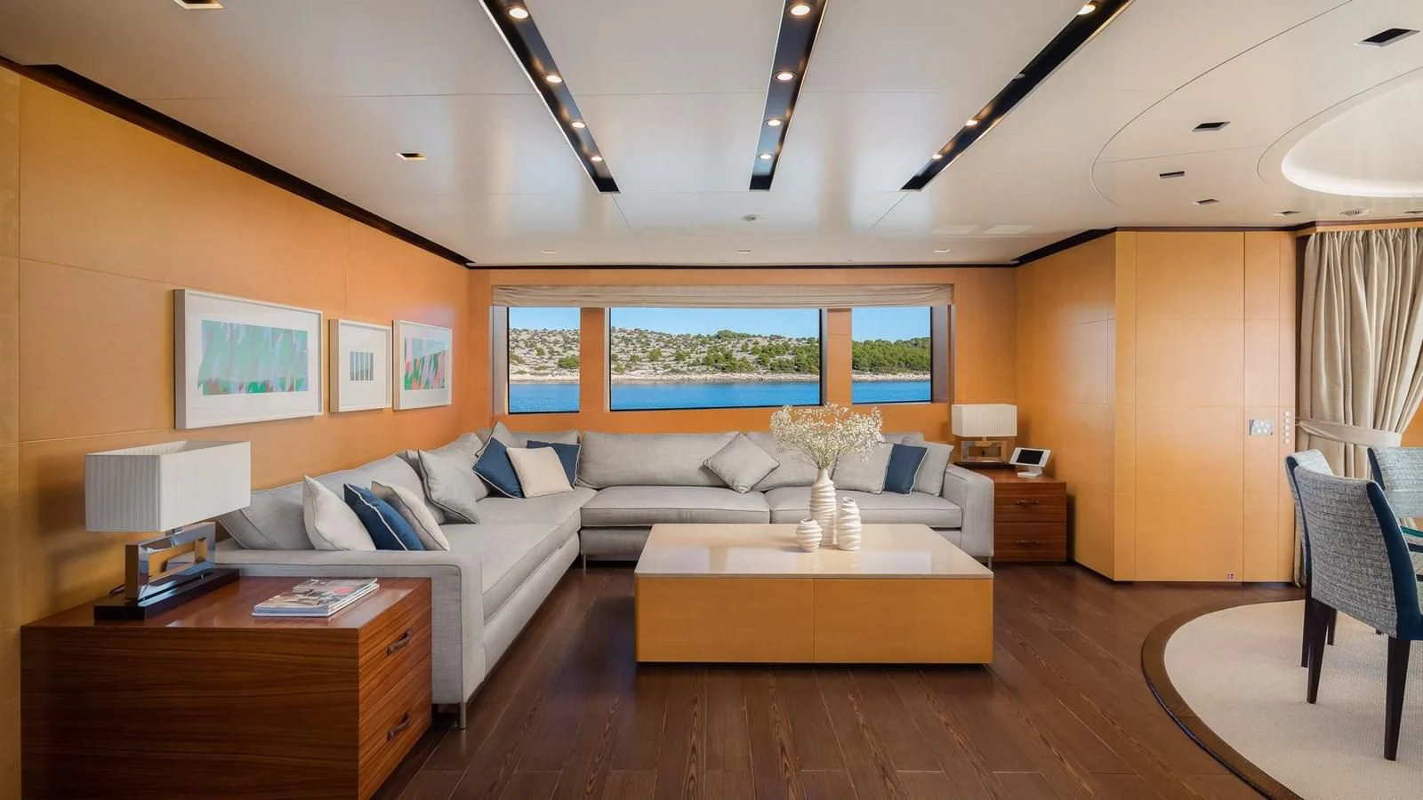 a living room with a large window aboard LAMMOUCHE Yacht for Sale