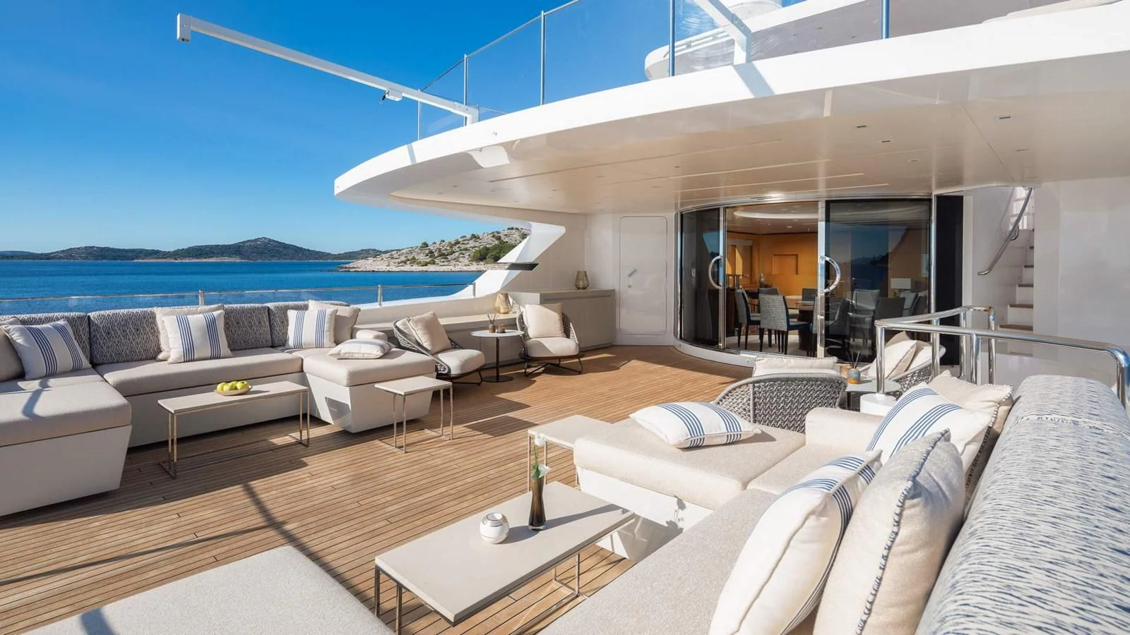 a living room with a large patio aboard LAMMOUCHE Yacht for Sale