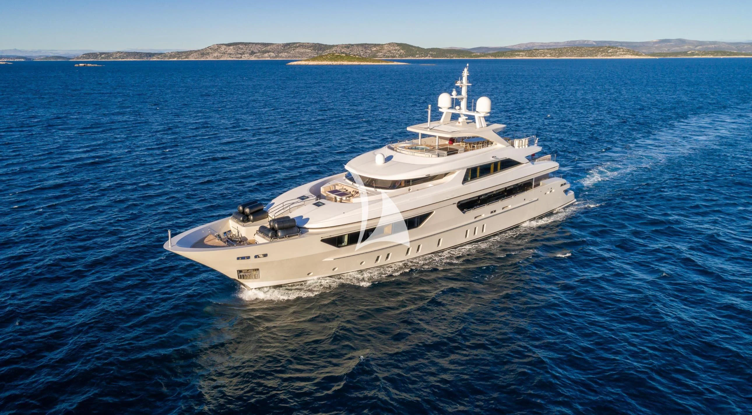 a white yacht in the water aboard LAMMOUCHE Yacht for Sale