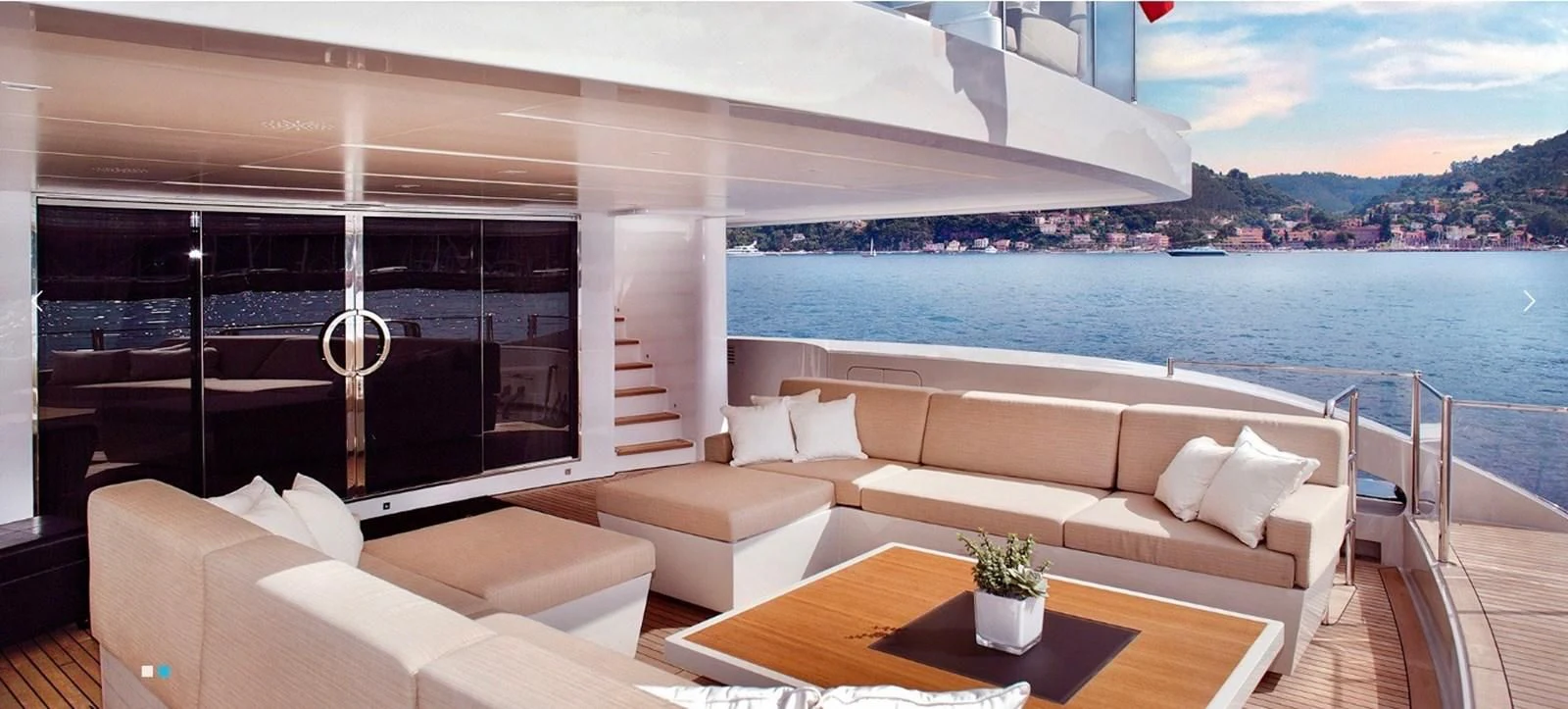 a living room with a large body of water aboard LAMMOUCHE Yacht for Sale