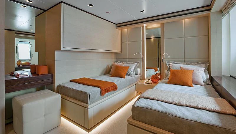a room with two beds aboard LAMMOUCHE Yacht for Sale