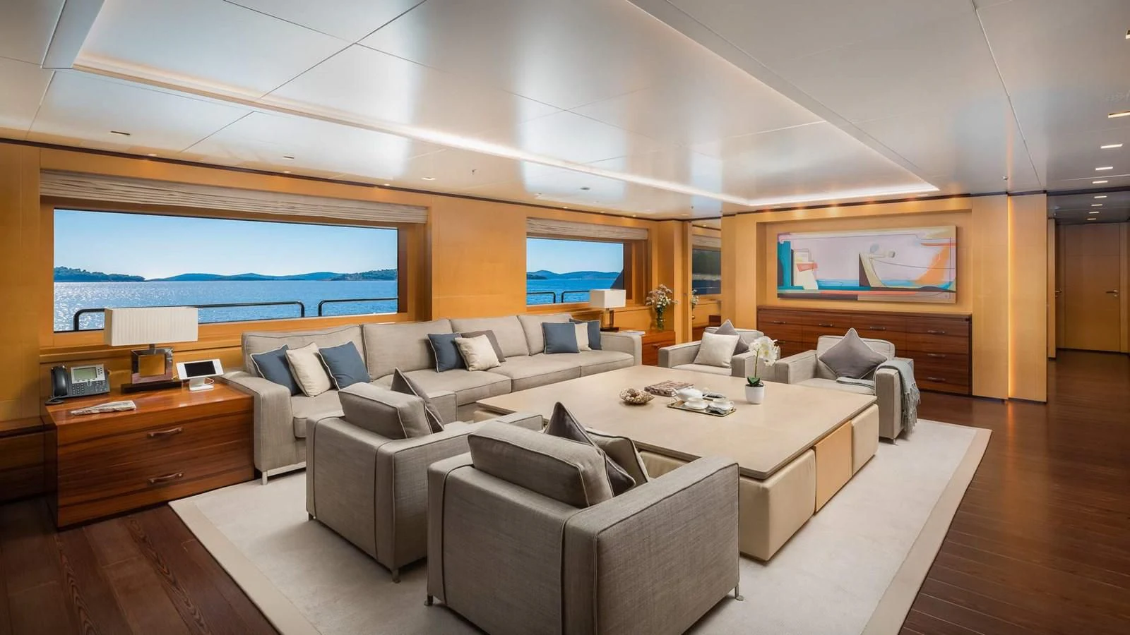 a large living room with a large screen aboard LAMMOUCHE Yacht for Sale