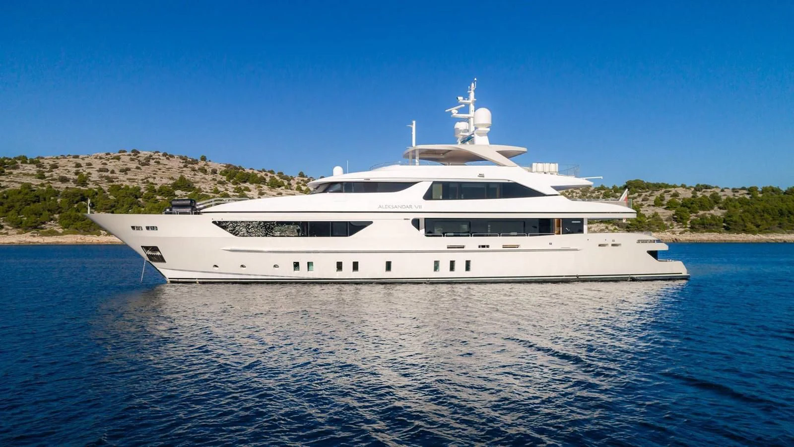 a white yacht on the water aboard LAMMOUCHE Yacht for Sale