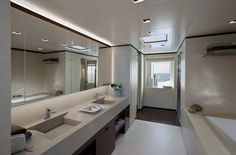 a bathroom with sinks and mirrors aboard LAMMOUCHE Yacht for Sale