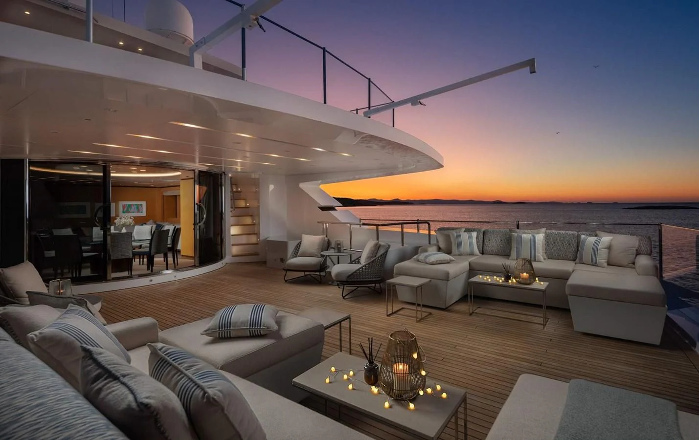 a living room with a fireplace aboard LAMMOUCHE Yacht for Sale