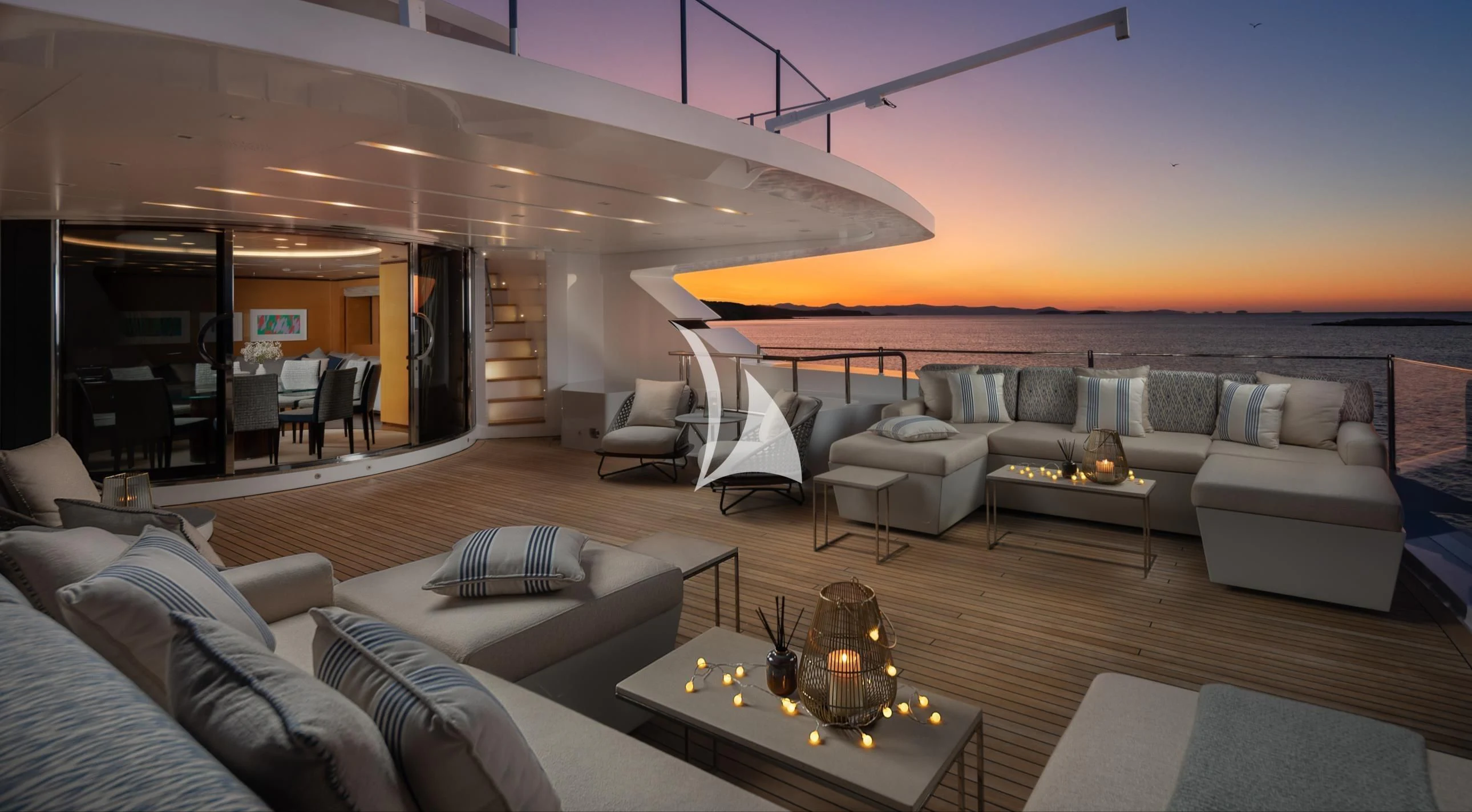 a living room with a couch and a coffee table aboard LAMMOUCHE Yacht for Sale