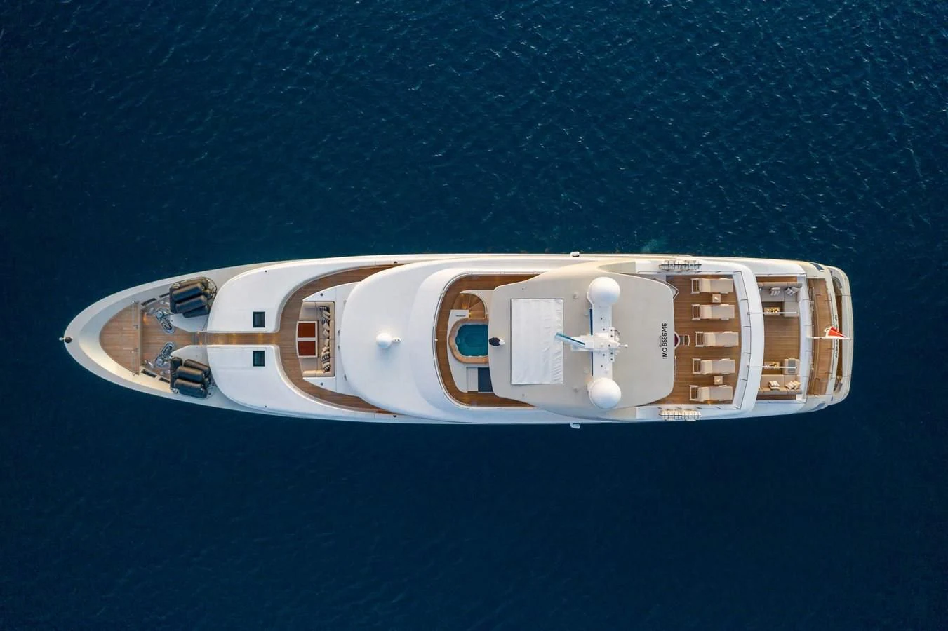 a white and brown boat on blue water aboard LAMMOUCHE Yacht for Sale