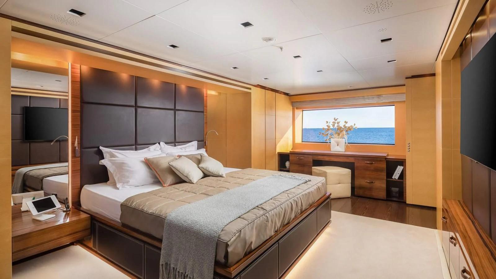 a bedroom with a large bed aboard LAMMOUCHE Yacht for Sale