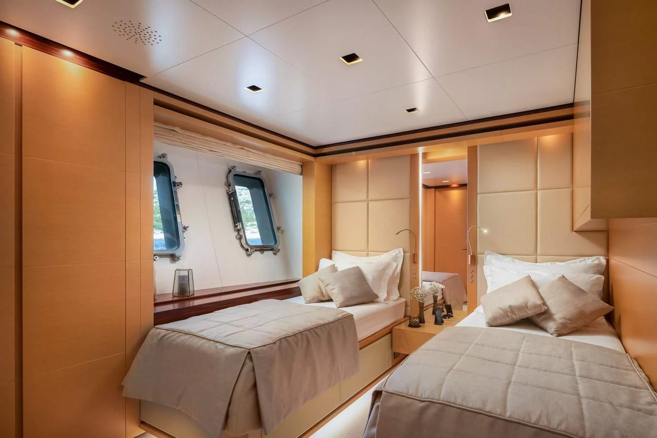 a room with two beds aboard LAMMOUCHE Yacht for Sale
