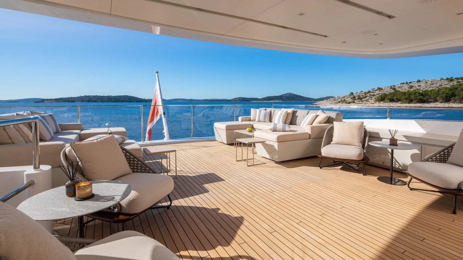 a large patio with chairs and tables aboard LAMMOUCHE Yacht for Sale