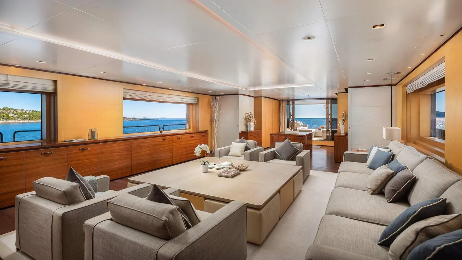 a living room with a large window aboard LAMMOUCHE Yacht for Sale