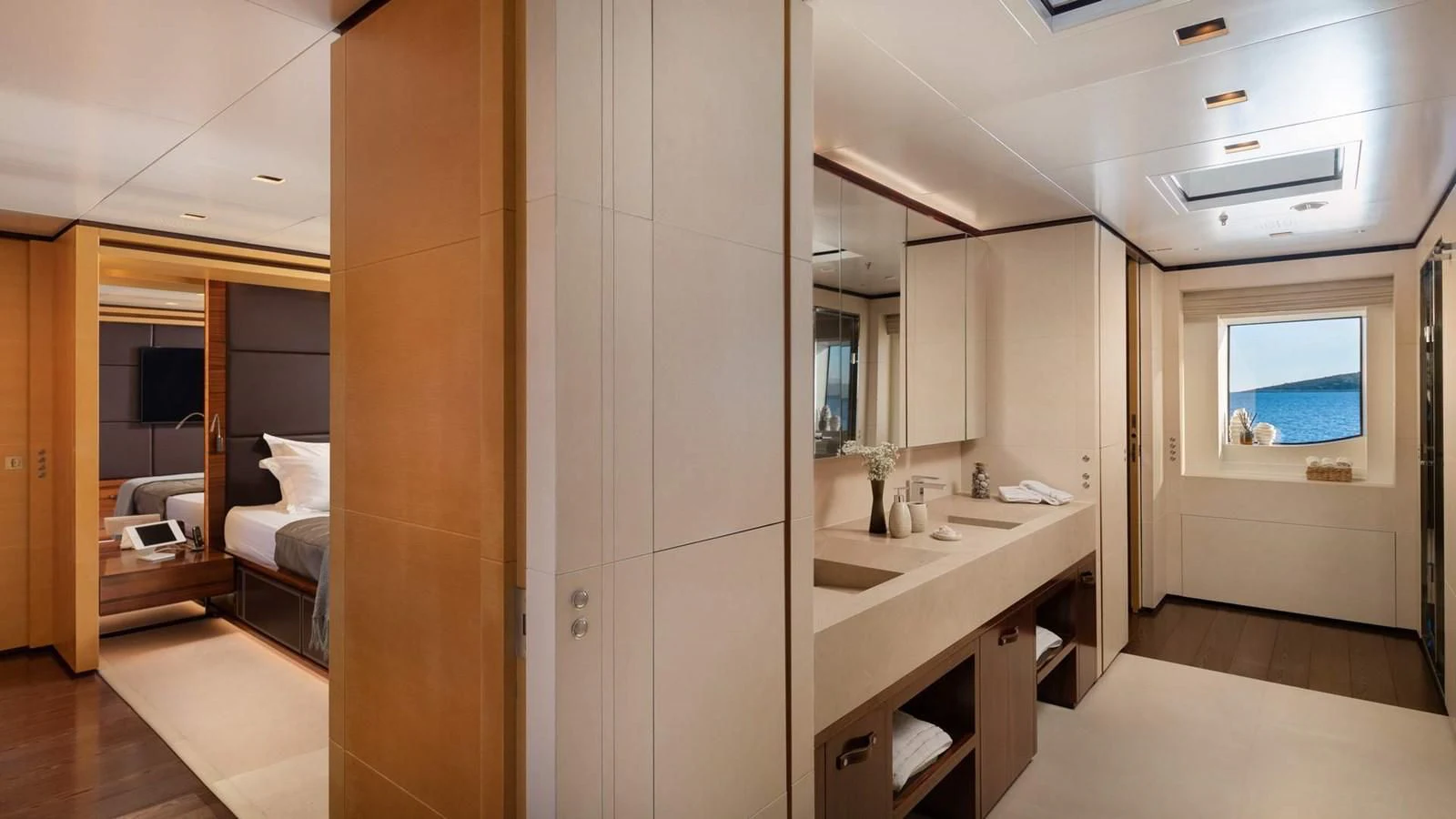 a bathroom with a sink and a mirror aboard LAMMOUCHE Yacht for Sale